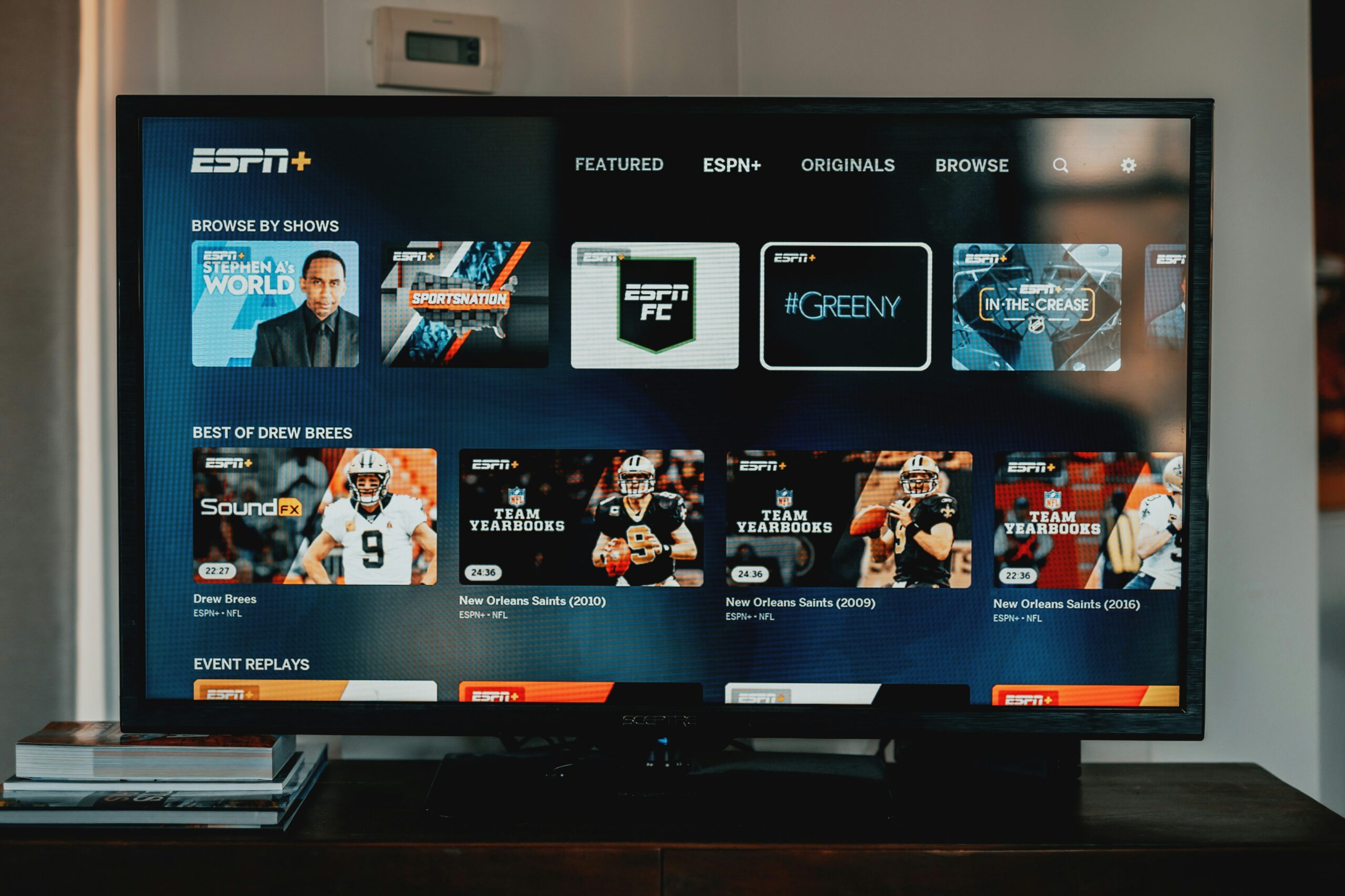 Smart TV interface displaying ESPN+ app for live sports streaming and on-demand athletic events.